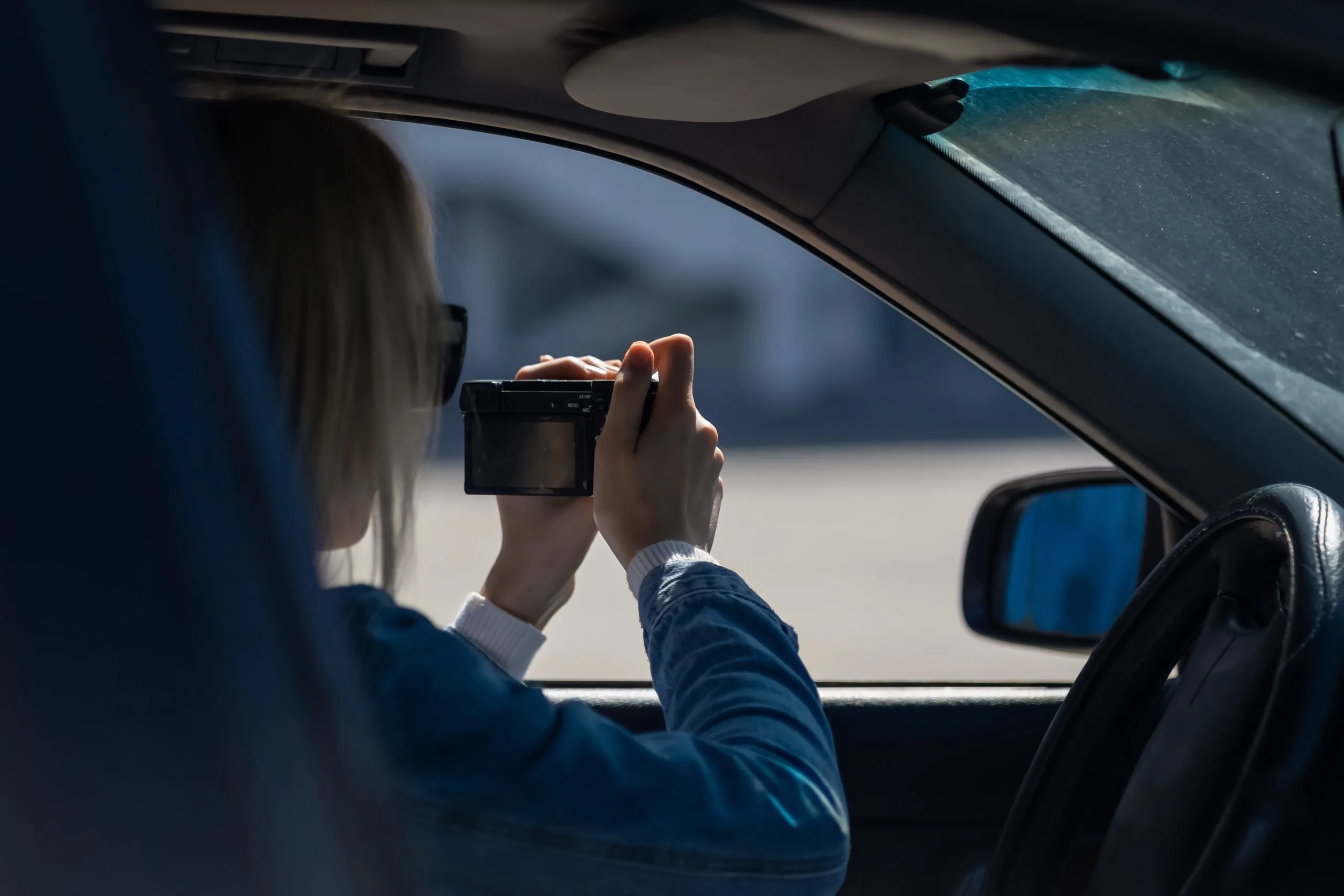 Nashville, TN 1 Investigator photographing from a parked car during surveillance