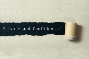 Private and confidential message revealed beneath torn paper